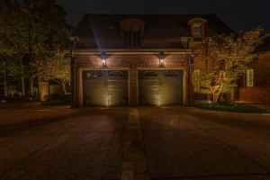 How does outdoor lighting improve security